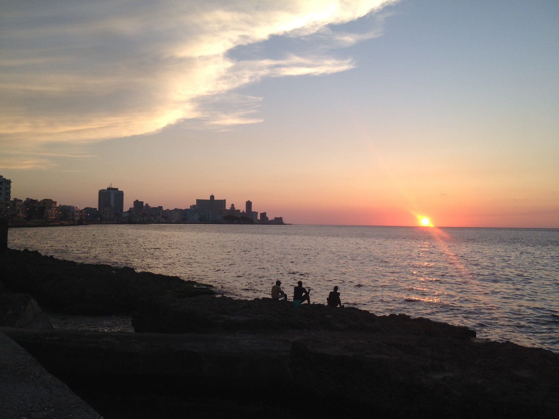 Havana. Sunset on the Malecón. Across the sea lies the United States.